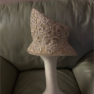 Mr Song, handmade.  Pearls, rhinestones, satin, feathers.